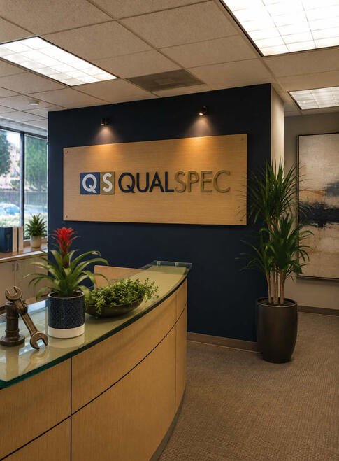 SOPHISTICATED INDUSTRIAL— Designed for a refinery business, this reception area blends industrial character with a polished executive presence. A focal wall immediately anchors the entry, creating a confident, welcoming first impression.